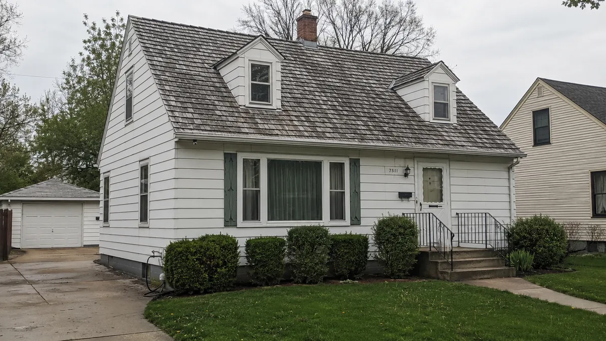 A weathered cedar shake roof on a home in the Milwaukee area