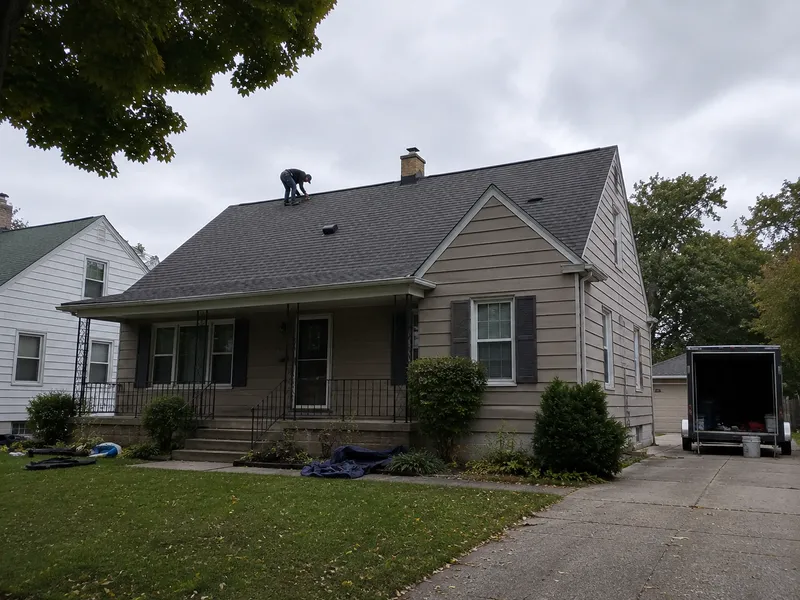 A completed asphalt shingle roof on a Milwaukee-area home